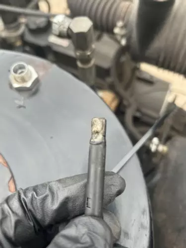 Warped and damaged photocell flame sensor from Nilfisk Contractor diesel hot pressure washer burner.